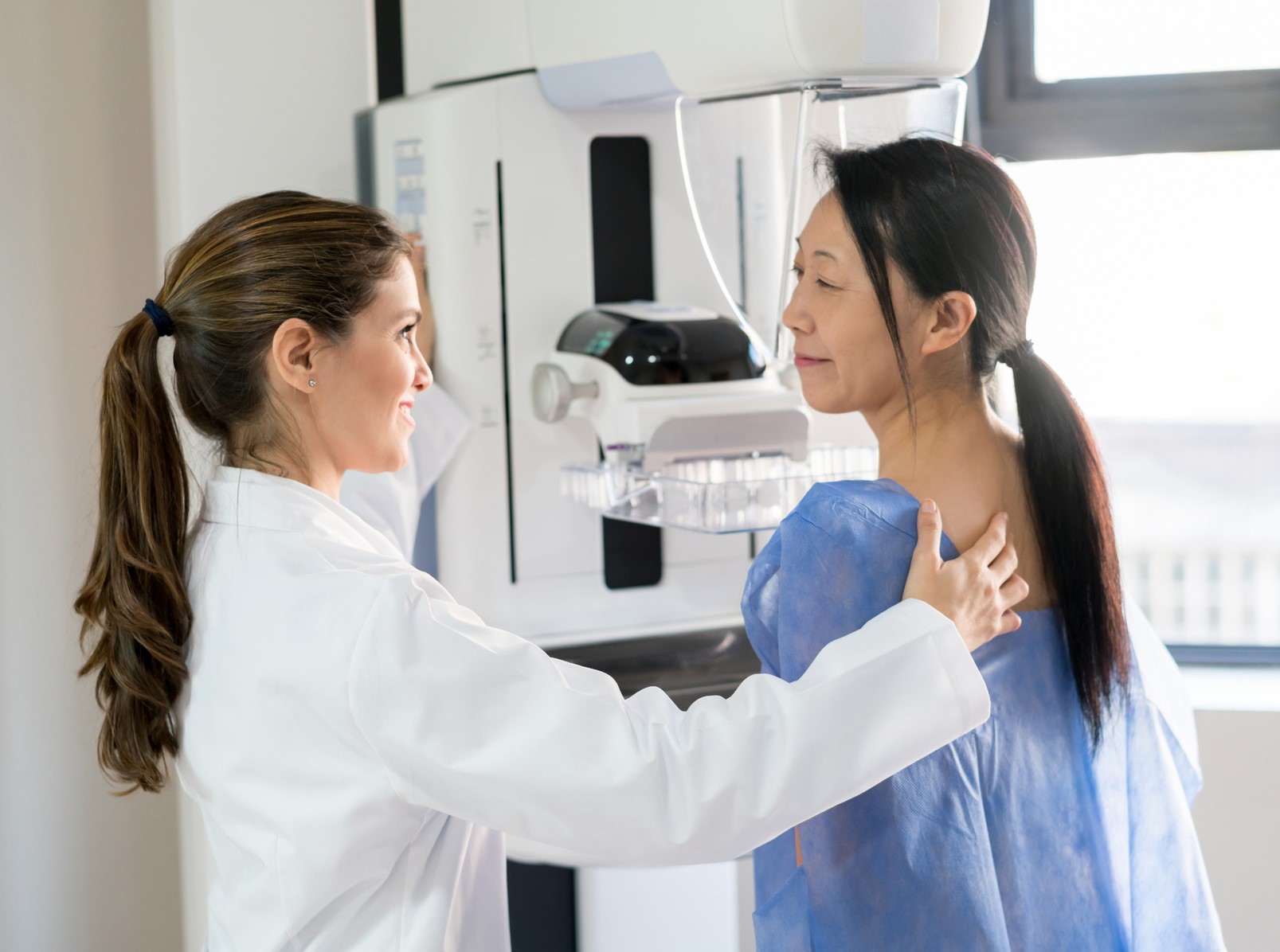 Woman getting mammogram. 