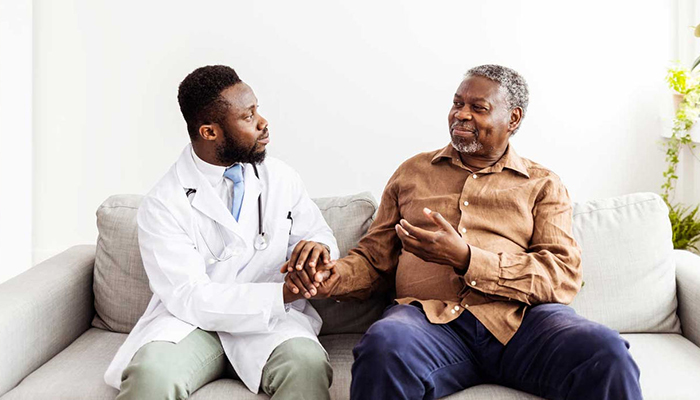 An senior patient with a younger doctor