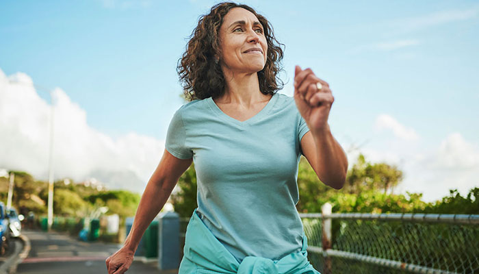 Woman walking outdoors